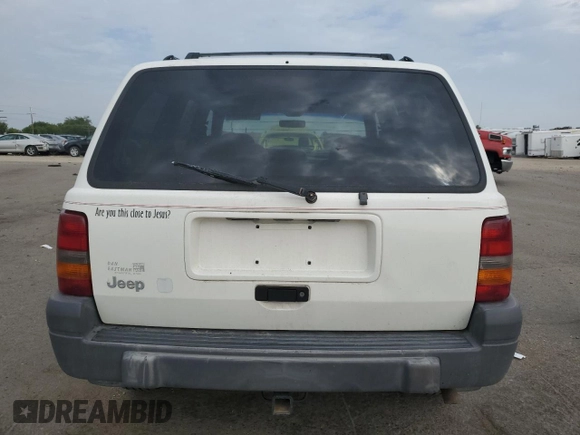 1997 Jeep Grand Cherokee Laredo with VIN 1J4GZ58S2VC676652, listed as a Copart auction lot 64939974 with 256,923 mi miles and Salvage Title. Bid and sale history available at carsss.com. Image 6.