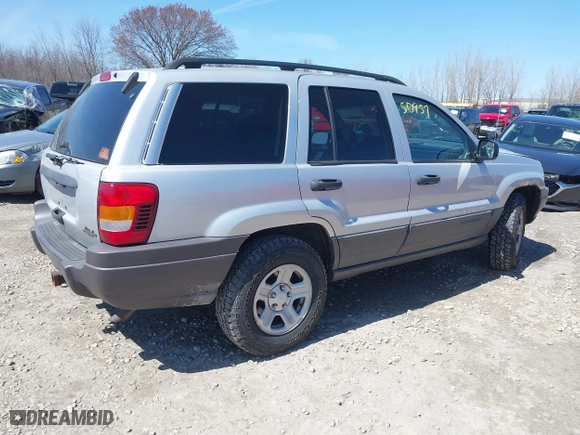 2002 Jeep Grand Cherokee Laredo with VIN 1J4GW48S42C324297, listed as a IAAI auction lot 42050957 with 135,542 mi miles. Bid and sale history available at carsss.com. Image 4.