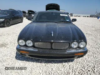 2002 Jaguar XJ with VIN SAJDA15BX2MF47193, listed as a Copart auction lot 49065275 with 69,544 mi miles and Salvage title. Bid and sale history available at DreamBid. Image 5.