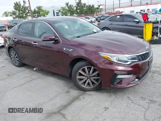 2019 Kia Optima LX z VIN 5XXGT4L37KG354649, wystawiony jako IAAI lot #42130410 z przebiegiem 61 315 mil mil oraz . Historia ofert i sprzedaży dostępna na DreamBid. Obrazek 1.