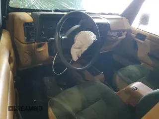 1998 Jeep Wrangler Sahara z VIN 1J4FY49S6WP730035, wystawiony jako Copart lot #59100505 z przebiegiem 225 354 mil mil oraz Szkoda całkowita • Salvage title. Historia ofert i sprzedaży dostępna na DreamBid. Obrazek 8.