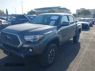 2019 Toyota Tacoma SR with VIN 3TMCZ5AN7KM251625, listed as a IAAI auction lot 42527478 with 45,689 mi miles and . Bid and sale history available at DreamBid. Image 2.
