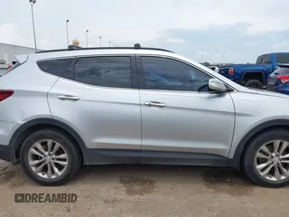 2018 Hyundai Santa Fe 2.0T z VIN 5XYZU4LA9JG537310, wystawiony jako IAAI lot #42393689 z przebiegiem Nie podano mil oraz . Historia ofert i sprzedaży dostępna na DreamBid. Obrazek 13.