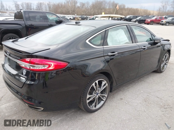 2017 Ford Fusion Titanium z VIN 3FA6P0K98HR200272, wystawiony jako IAAI lot #41905017 z przebiegiem 104 132 mil mil oraz . Historia ofert i sprzedaży dostępna na DreamBid. Obrazek 4.