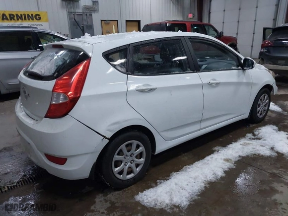 2012 Hyundai Accent GS with VIN KMHCT5AE8CU042470, listed as a IAAI auction lot 41021964 with 94,574 mi miles. Bid and sale history available at carsss.com. Image 4.