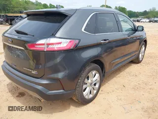 2020 Ford Edge Titanium z VIN 2FMPK4K98LBA76737, wystawiony jako IAAI lot #41981689 z przebiegiem 93 501 mil mil oraz . Historia ofert i sprzedaży dostępna na DreamBid. Obrazek 4.