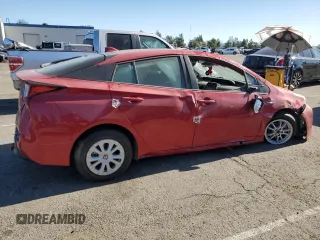 2021 Toyota Prius L Eco with VIN JTDKAMFUXM3148409, listed as a Copart auction lot 83393084 with 72,241 mi miles and Clean Title. Bid and sale history available at carsss.com. Image 3.