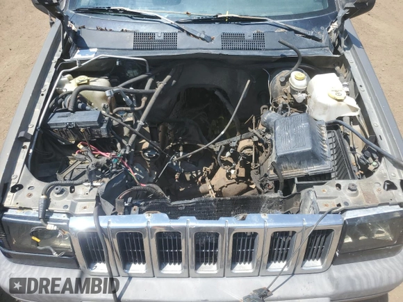 1997 Jeep Grand Cherokee Laredo z VIN 1J4GZ58S6VC636803, wystawiony jako Copart lot #59977115 z przebiegiem Nie podano mil oraz Szkoda całkowita • Salvage title. Historia ofert i sprzedaży dostępna na DreamBid. Obrazek 12.