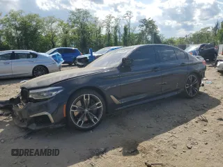 2020 BMW 5 Series M550i xDrive z VIN WBAJS7C03LCD00279, wystawiony jako Copart lot #55698035 z przebiegiem 76 057 mil mil oraz Czysty tytuł • Clean title. Historia ofert i sprzedaży dostępna na DreamBid. Obrazek 1.