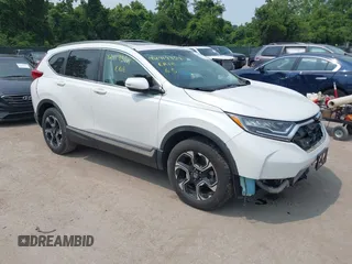 2019 Honda CR-V Touring with VIN 7FARW2H98KE041621, listed as a IAAI auction lot 42419354 with 63,824 mi miles and . Bid and sale history available at DreamBid. Image 1.