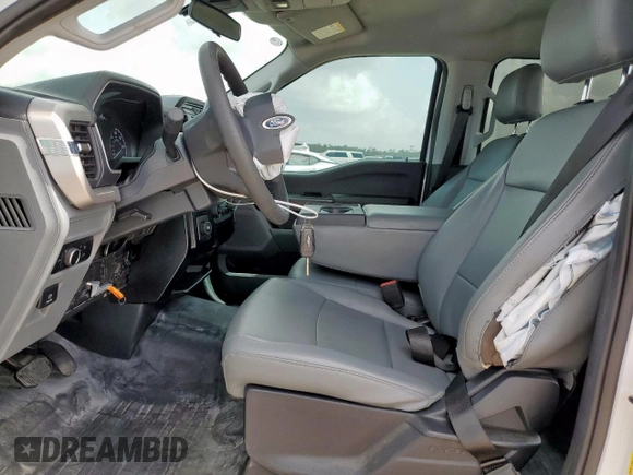 2023 Ford F-150 XL с VIN 1FTEW1CP9PKG21142, выставлен на аукционе Copart как лот 63073825 с пробегом 18 539 миль миль и Списание • Salvage title. История ставок и продаж доступна на DreamBid. Изображение 7.