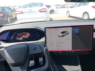 2023 Tesla Model S with VIN 5YJSA1E51PF499919, listed as a IAAI auction lot 42459166 with 6,612 mi miles and . Bid and sale history available at DreamBid. Image 19.