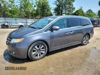 2014 Honda Odyssey Touring z VIN 5FNRL5H94EB051041, wystawiony jako Copart lot #63499865 z przebiegiem 162 795 mil mil oraz Szkoda całkowita • Salvage title. Historia ofert i sprzedaży dostępna na DreamBid. Obrazek 1.