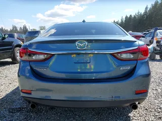 2016 Mazda Mazda6 i Grand Touring with VIN JM1GJ1W51G1436977, listed as a IAAI auction lot 42097363 with 128,941 mi miles. Bid and sale history available at carsss.com. Image 16.