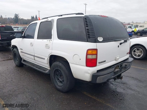 2003 GMC Yukon SLT with VIN 1GKEC13T73R281551, listed as a IAAI auction lot 41522305 with 214,489 mi miles. Bid and sale history available at carsss.com. Image 3.