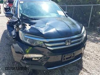 2016 Honda Pilot Elite with VIN 5FNYF6H08GB070057, listed as a IAAI auction lot 42103166 with Not Provided miles. Bid and sale history available at carsss.com. Image 12.
