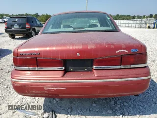 1997 Ford Crown Victoria LX с VIN 2FALP74W7VX148869, выставлен на аукционе Copart как лот 69004924 с пробегом 226 648 миль миль и Списание • Salvage title. История ставок и продаж доступна на DreamBid. Изображение 6.
