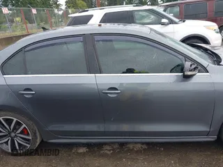 2014 Volkswagen Jetta GLI z VIN 3VW4T7AJ2EM208598, wystawiony jako IAAI lot #42381855 z przebiegiem 82 761 mil mil oraz . Historia ofert i sprzedaży dostępna na DreamBid. Obrazek 13.