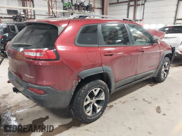 2015 Jeep Cherokee Trailhawk with VIN 1C4PJMBS7FW646577, listed as a IAAI auction lot 41404911 with 85,343 mi miles and . Bid and sale history available at DreamBid. Image 4.