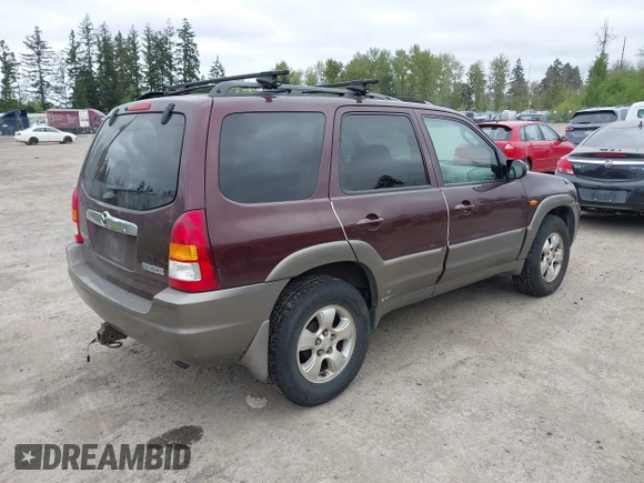 2001 Mazda Tribute LX with VIN 4F2CU08141KM10269, listed as a IAAI auction lot 42138704 with 166,825 mi miles and . Bid and sale history available at carsss.com. Image 4.