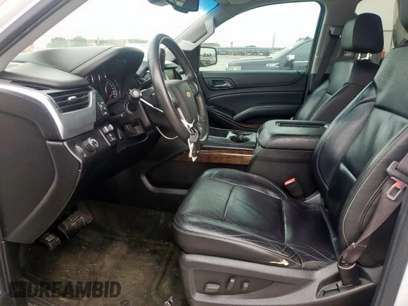2015 Chevrolet Tahoe LT with VIN 1GNSCBKC0FR210211, listed as a Copart auction lot 55496995 with 128,296 mi miles and Salvage title. Bid and sale history available at DreamBid. Image 7.