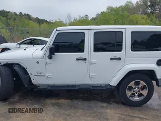 2017 Jeep Wrangler Unlimited Sahara with VIN 1C4BJWEG3HL752719, listed as a IAAI auction lot 41892600 with 127,486 mi miles. Bid and sale history available at carsss.com. Image 15.