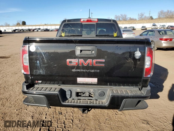 2021 GMC Canyon 4WD AT4 w/Cloth with VIN 1GTG6FEN9M1254293, listed as a Copart auction lot 87163874 with 33,645 mi miles and Salvage Title. Bid and sale history available at carsss.com. Image 6.