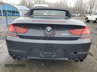 2013 BMW M6 z VIN WBSLZ9C55DDZ77804, wystawiony jako Copart lot #54121185 z przebiegiem 66 286 mil mil oraz Czysty tytuł • Clean title. Historia ofert i sprzedaży dostępna na DreamBid. Obrazek 6.