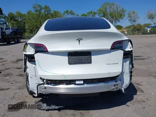 2022 Tesla Model Y Long Range with VIN 7SAYGAEE8NF431786, listed as a IAAI auction lot 41750353 with 67,846 mi miles and . Bid and sale history available at carsss.com. Image 17.