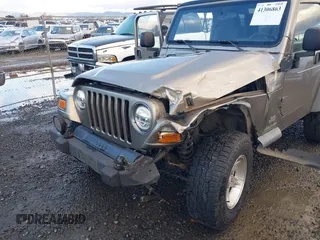 2004 Jeep Wrangler Sport with VIN 1J4FA49S94P711531, listed as a IAAI auction lot 41306863 with 143,720 mi miles and . Bid and sale history available at DreamBid. Image 6.