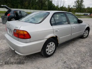 2000 Honda Civic VP with VIN 2HGEJ6611YH525471, listed as a Copart auction lot 69864324 with 115,313 mi miles and Salvage Title. Bid and sale history available at carsss.com. Image 3.