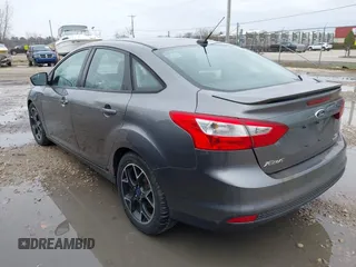 2012 Ford Focus SE with VIN 1FAHP3F21CL415006, listed as a IAAI auction lot 42073643 with 168,516 mi miles. Bid and sale history available at carsss.com. Image 3.