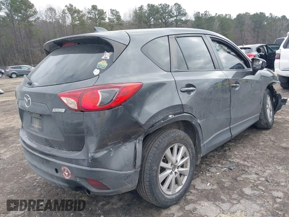 2015 Mazda CX-5 Touring with VIN JM3KE2CY2F0461935, listed as a IAAI auction lot 41430070 with 220,857 mi miles and . Bid and sale history available at DreamBid. Image 4.