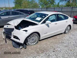 2013 Ford Fusion SE Hybrid z VIN 3FA6P0LU9DR349321, wystawiony jako IAAI lot #42156321 z przebiegiem 90 688 mil mil oraz . Historia ofert i sprzedaży dostępna na DreamBid. Obrazek 2.
