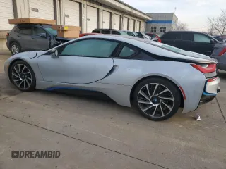 2015 BMW i8 z VIN WBY2Z2C56FV674231, wystawiony jako Copart lot #37218014 z przebiegiem 27 465 mil mil oraz . Historia ofert i sprzedaży dostępna na DreamBid. Obrazek 2.
