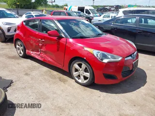 2015 Hyundai Veloster z VIN KMHTC6AD2FU236607, wystawiony jako IAAI lot #42399822 z przebiegiem 166 043 mil mil oraz . Historia ofert i sprzedaży dostępna na DreamBid. Obrazek 1.