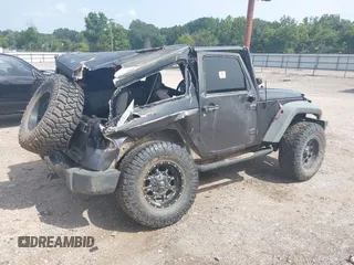 2014 Jeep Wrangler Sport with VIN 1C4AJWAGXEL233647, listed as a IAAI auction lot 39993785 with Not Provided miles and . Bid and sale history available at DreamBid. Image 4.