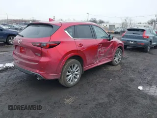 2023 Mazda CX-5 Signature with VIN JM3KFBXY3P0282456, listed as a IAAI auction lot 41542915 with 3,376 mi miles and . Bid and sale history available at carsss.com. Image 4.