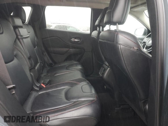 2014 Jeep Cherokee Trailhawk z VIN 1C4PJMBS7EW236960, wystawiony jako Copart lot #57098695 z przebiegiem 159 065 mil mil oraz Czysty tytuł • Clean title. Historia ofert i sprzedaży dostępna na DreamBid. Obrazek 11.