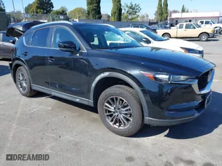 2021 Mazda CX-5 Touring with VIN JM3KFACM2M0339349, listed as a IAAI auction lot 41651005 with NaN miles. Bid and sale history available at carsss.com. Image 1.
