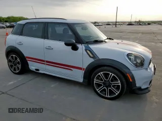 2014 MINI Countryman S with VIN WMWZC3C53EWT01161, listed as a Copart auction lot 50586965 with 151,813 mi miles and Salvage Title. Bid and sale history available at DreamBid. Image 4.