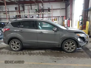 2014 Ford Escape Titanium with VIN 1FMCU9J90EUC31625, listed as a IAAI auction lot 41492075 with 301,917 mi miles and . Bid and sale history available at DreamBid. Image 13.