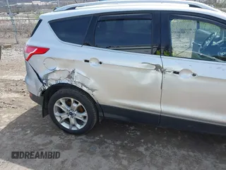 2016 Ford Escape Titanium with VIN 1FMCU9JX3GUA62802, listed as a IAAI auction lot 42001690 with 124,452 mi miles. Bid and sale history available at carsss.com. Image 6.