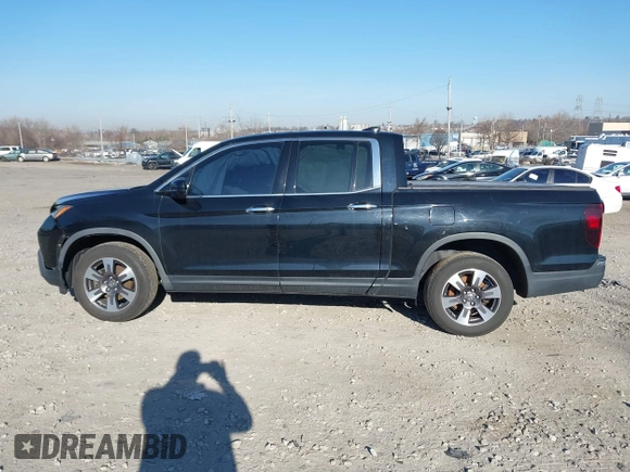 2019 Honda Ridgeline RTL-E with VIN 5FPYK3F7XKB033652, listed as a IAAI auction lot 41751421 with 96,774 mi miles and . Bid and sale history available at DreamBid. Image 13.