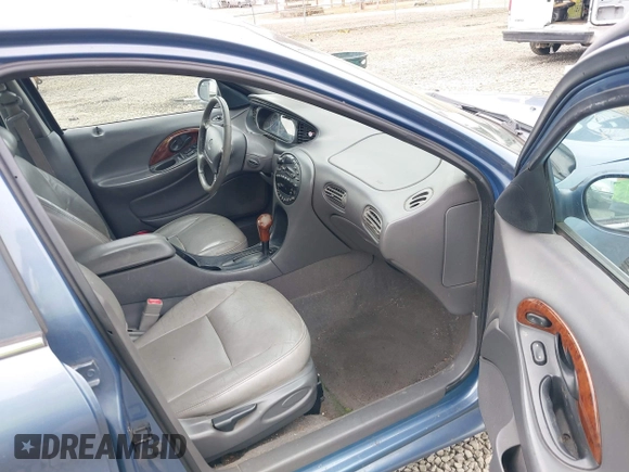 1999 Mercury Sable LS z VIN 1MEFM53S5XA647862, wystawiony jako IAAI lot #41762714 z przebiegiem 165 490 mil mil oraz . Historia ofert i sprzedaży dostępna na DreamBid. Obrazek 5.