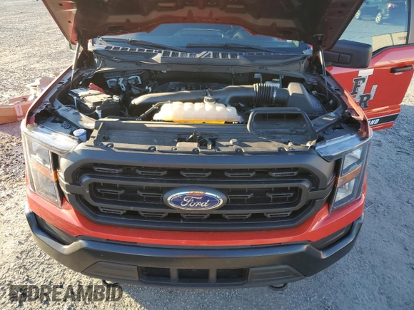 2023 Ford F-150 with VIN 1FTFW1P85PKD82406, listed as a Copart auction lot 84744944 with 32,982 mi miles and Salvage title. Bid and sale history available at DreamBid. Image 11.