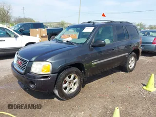 2006 GMC Envoy SLT with VIN 1GKDS13SX62247347, listed as a IAAI auction lot 42031142 with 263,599 mi miles. Bid and sale history available at carsss.com. Image 2.