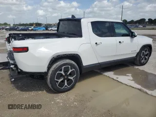2023 Rivian R1T Adventure z VIN 7FCTGBAA5PN028668, wystawiony jako Copart lot #61126184 z przebiegiem 2337 mil mil oraz Szkody całkowita. Historia ofert i sprzedaży dostępna na DreamBid. Obrazek 3.