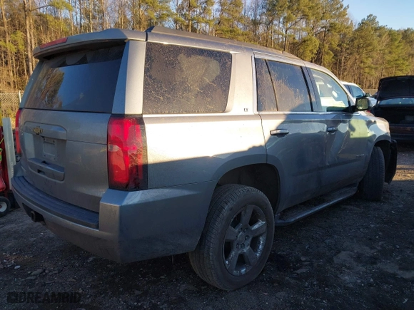 2019 Chevrolet Tahoe LT with VIN 1GNSCBKC8KR123828, listed as a IAAI auction lot 41256573 with 125,618 mi miles. Bid and sale history available at carsss.com. Image 4.