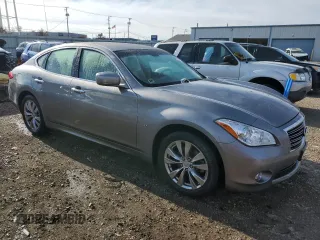 2014 Infiniti M37 with VIN JN1BY1AP2EM260051, listed as a Copart auction lot 87276884 with 101,899 mi miles and Salvage Title. Bid and sale history available at carsss.com. Image 4.